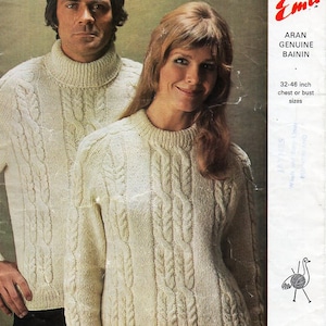May include: A knitting pattern for a white Aran sweater, featuring a cable knit design. The pattern is for sizes 32-46 inches chest or bust. The pattern is from Emu Aran Genuine Bainin.