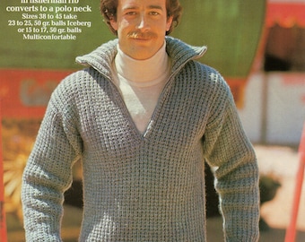 May include: A gray knitted sweater with a zipper and a v-neck. The sweater is made with a fisherman rib stitch and can be converted to a polo neck. The text on the image reads: "Zipped sweater in fisherman rib converts to a polo neck Sizes 38 to 45 take 23 to 25, 50 gr. balls Iceberg or 15 to 17, 50 gr. balls Multiconfortable 7739"