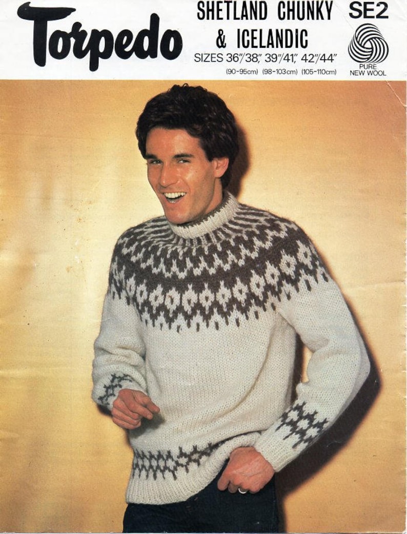 May include: A white sweater with a brown and white geometric pattern. The sweater has a high neck and long sleeves. The sweater is made of Shetland chunky and Icelandic wool. The text "Torpedo & Icelandic" is printed on the top of the image. The text "Sizes 36"/38" 39"/41, 42"/44" (90-95cm) (98-103cm) (105-110cm) Pure New Wool" is printed below the text "Torpedo & Icelandic".