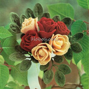 May include: A crocheted bouquet of red and yellow roses with green leaves. The roses are made with yarn and have a realistic appearance.