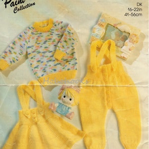 May include: Knitting pattern for a yellow baby outfit with a jumper, a dress with straps, and a sweater with a colorful pattern. The pattern is from the Paint Pot Collection and is for sizes 16-22 inches (41-56 cm).