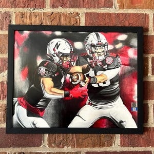 Druck - Husker Blackshirts Handoff