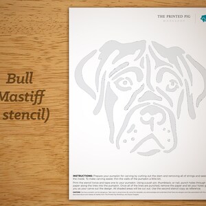 May include: A printable stencil of a Bull Mastiff dog's head, designed for carving pumpkins. The stencil is printed on white paper with a gray outline of the dog's head. The instructions for using the stencil are printed at the bottom of the page.