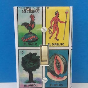 May include: A light switch cover with a colorful design featuring images from a traditional Mexican game called Loteria. The images include a rooster, a devil, a tree, a melon, a dove, and a bird. The switch is in the "on" position.