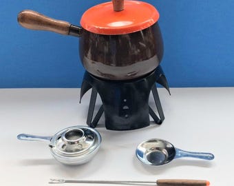 Vintage Fondue Set With Fondue Pot, Stand, Burner, Two Forks, Retro Fondue Set With Contrasting Orange Lid With Wood Handle.