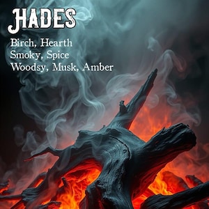 May include: A close-up of burning wood with smoke rising above it. The text "HADES" is at the top of the image, followed by a list of scents: Birch, Hearth, Smoky, Spice, Woodsy, Musk, Amber. The text "The Magick Cabinet" is at the bottom of the image.
