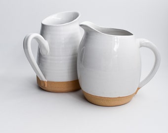 pitcher. White pitcher, Handmade pitcher, handmade pottery, one-of-a-kind pottery. Modern pottery & serve ware.  open shelving