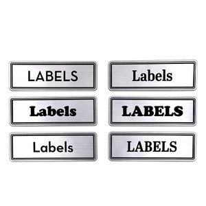 May include: Six silver rectangular labels with black text that reads "LABELS" and "Labels".
