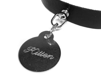 May include: A black leather choker with a silver metal tag that says "Kitten".