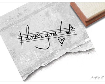 Stamp text stamp I love you! On staves-font stamps for Valentine's Day greetings, for cards, gifts, decorations