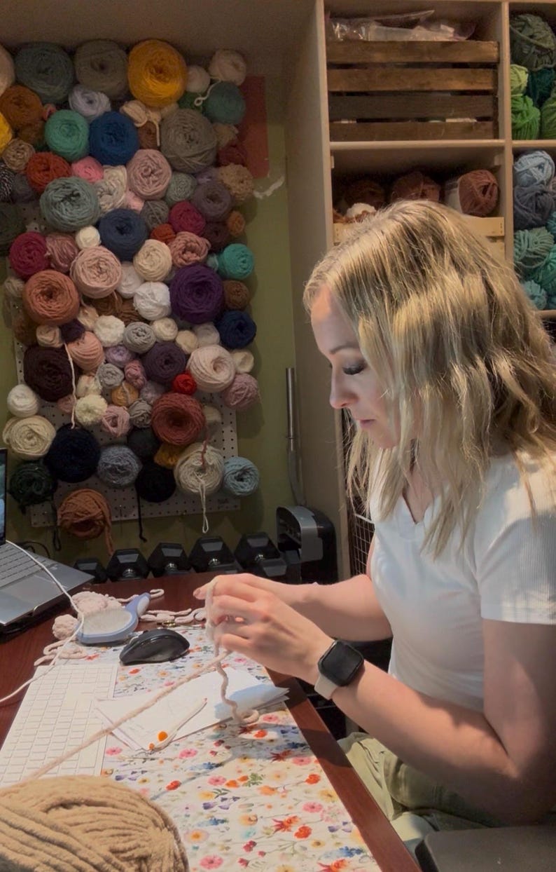 Crochet designer working on handmade amigurumi animal patterns