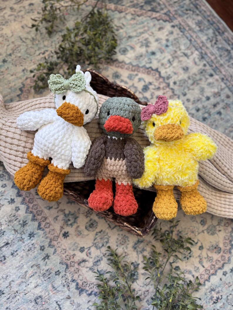 Beginner friendly duck amigurumi pattern showing two finished crochet duck toys