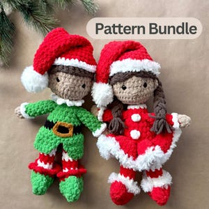 May include: Two handmade crochet dolls featuring the text Pattern Bundle. One doll wears a green elf outfit with a red hat, while the other wears a red dress with a red hat and brown braided hair. Both dolls have white trim.