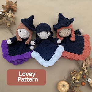 May include: Three crocheted lovey dolls featuring witch hats and yarn hair. The left doll has light brown hair and a purple skirt edge. The center doll has a white skirt edge. The right doll has reddish hair and an orange skirt edge. Text reads Lovey Pattern.