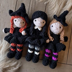 Three crochet witch dolls in different hair colors displayed together to show color customization for the witch amigurumi pattern.