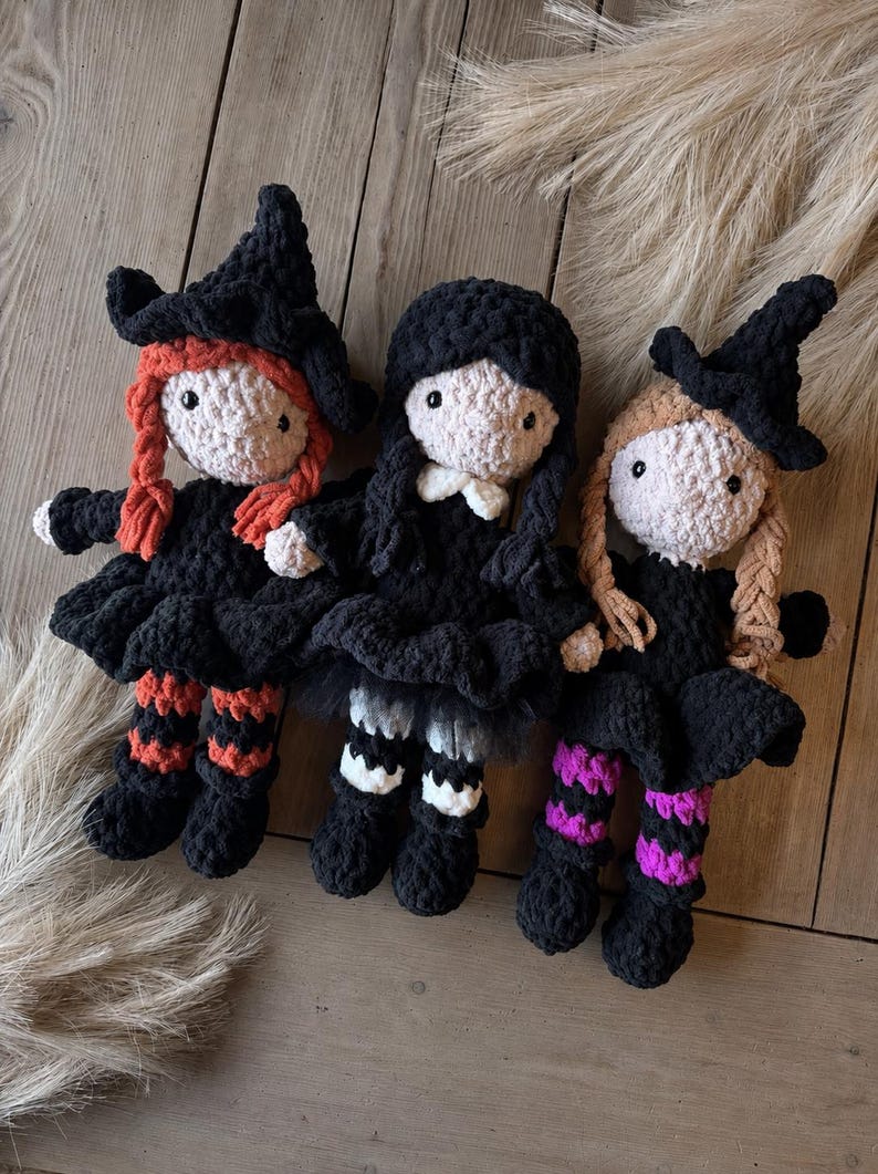 Three crochet witch dolls in different hair colors displayed together to show color customization for the witch amigurumi pattern.
