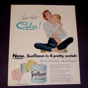 May include: Vintage advertisement for ScotTissue toilet paper. The ad features a woman holding a baby, with text that reads "Love that Color!" and "New... ScotTissue in 4 pretty pastels." The image includes rolls of blue, yellow, and pink toilet paper.