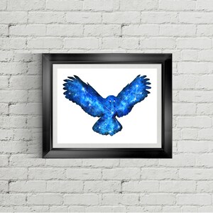 May include: A framed print of a blue watercolor owl with a constellation design. The owl is in flight with its wings spread wide.