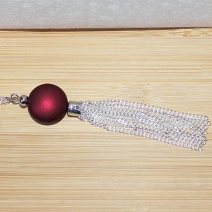 Long silver necklace with burgundy red focal bead and tassel pendant image 5