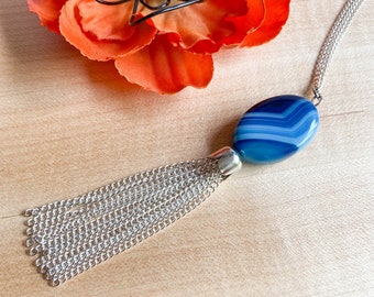 Long silver and bead necklace with sea blue stripe agate focal bead and tassel pendant