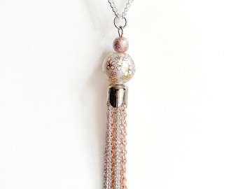 Long silver and rose gold plated tassel necklace with floral glass pearl focal beaded pendant