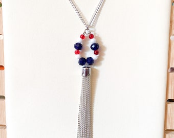 Long silver necklace with red, white and blue beaded teardrop & tassel