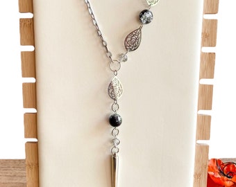 Long silver tone and black crackle bead lariat necklace with floral rose connectors