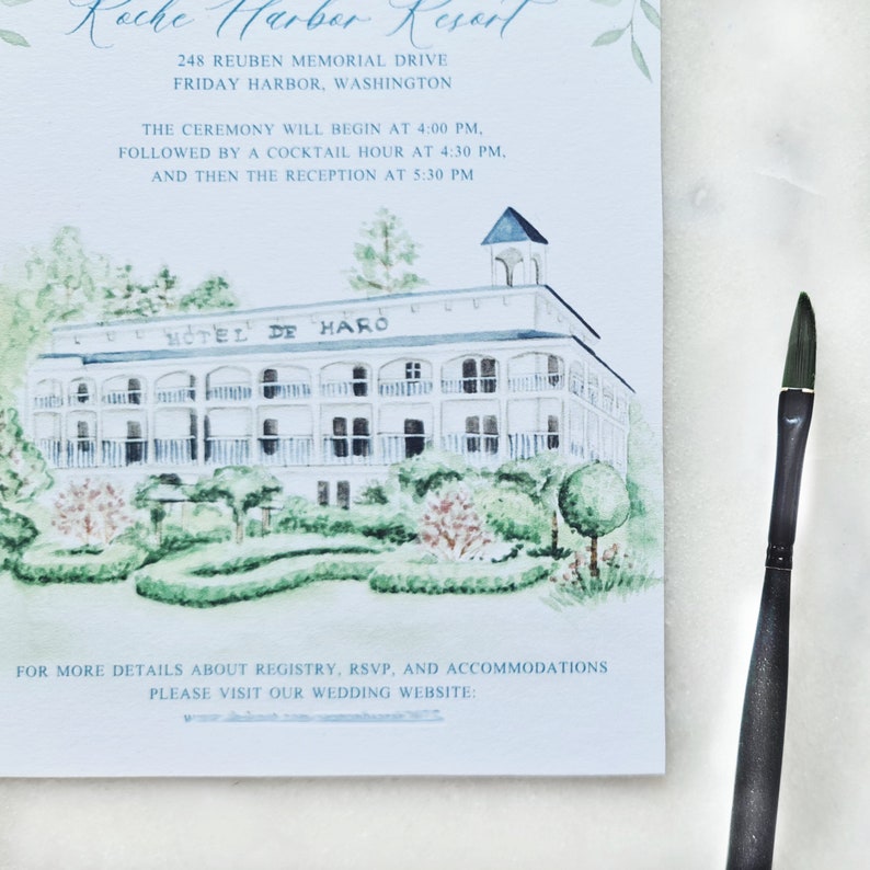 May include: A wedding invitation card featuring a watercolor illustration of the Hotel de Haro at Roche Harbor Resort, with text detailing the event schedule and location, accompanied by a black paintbrush resting on the right side of the card.