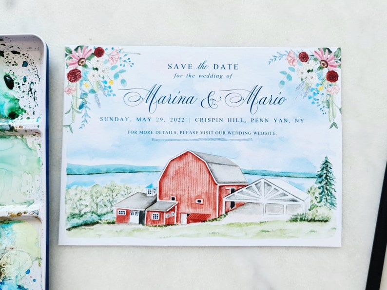 May include: A rectangular wedding save the date card featuring a watercolor illustration of a red barn near a lake. The text reads: SAVE THE DATE for the wedding of Marina & Mario, SUNDAY, MAY 29, 2022 | CRISPIN HILL, PENN YAN, NY.