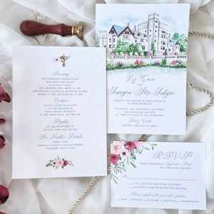 May include: Wedding invitation suite with a watercolor illustration of Hatley Castle in Victoria, British Columbia. The invitation features a floral design with pink, red, and white flowers. The text on the invitation reads "Liz Cave and Imogen McTye, Request the honor of your presence at their marriage, Saturday, the seventh of December, two thousand nineteen, at three o'clock in the afternoon, Hatley Castle, Victoria, British Columbia".