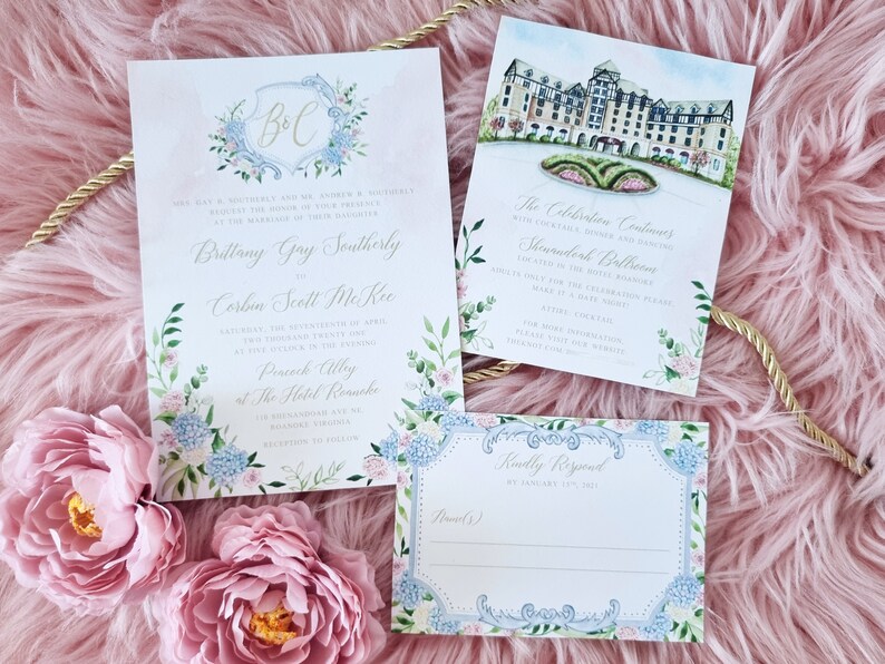 May include: A wedding invitation suite with a watercolor design featuring a floral motif and a monogram of the couple's initials. The invitation includes the names of the bride and groom, the date and time of the wedding, and the location. The RSVP card is also included.