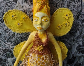 Paper mache hanging doll. Yellow pixie with butterfly wings with diamonds in a lace dress and socks. Multimedia sculpture one of a kind.