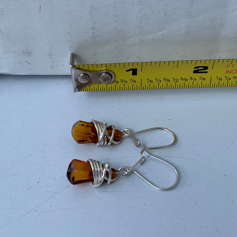 Wire Wrap Baltic Amber Earrings Centered in Sterling Silver Accents Stunning Colors and Design Don\u2019t Limit Your Lifestyle