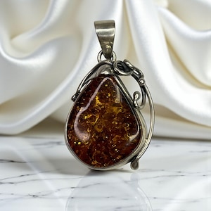Amber Pendant With 925 Sterling Silver Setting & Intricate Design