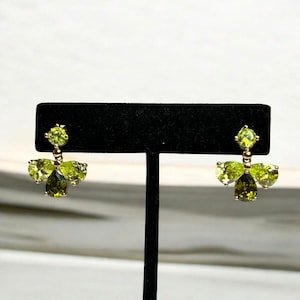 Gold-Toned Green Crystal Drop Earrings With Floral Design