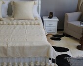 Moroccan Pom Pom Ivory White Cotton Blanket and throw with braided tassels loomed by hand for Eclectic Bohemian and Berber Decoration