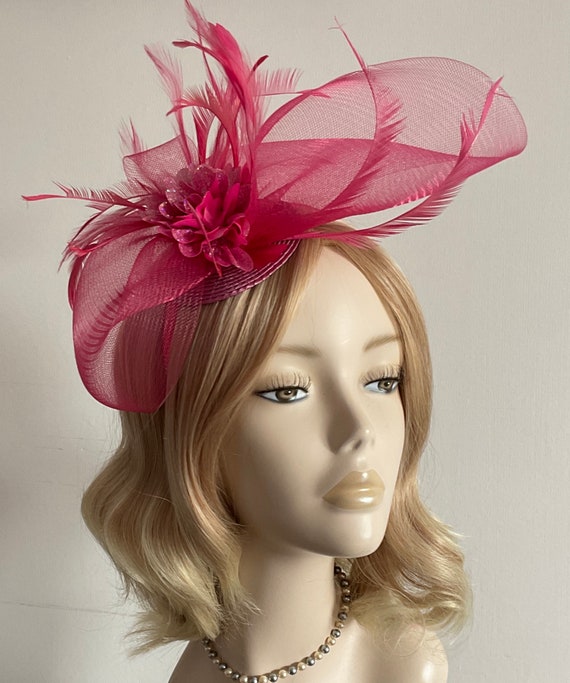 A RASPBERRY PINK FASCINATOR Made of 