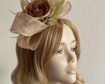 A BEIGE and SAGE FASCINATOR, With sinamay, feathers, Ombré Silk flower, on a gold headband