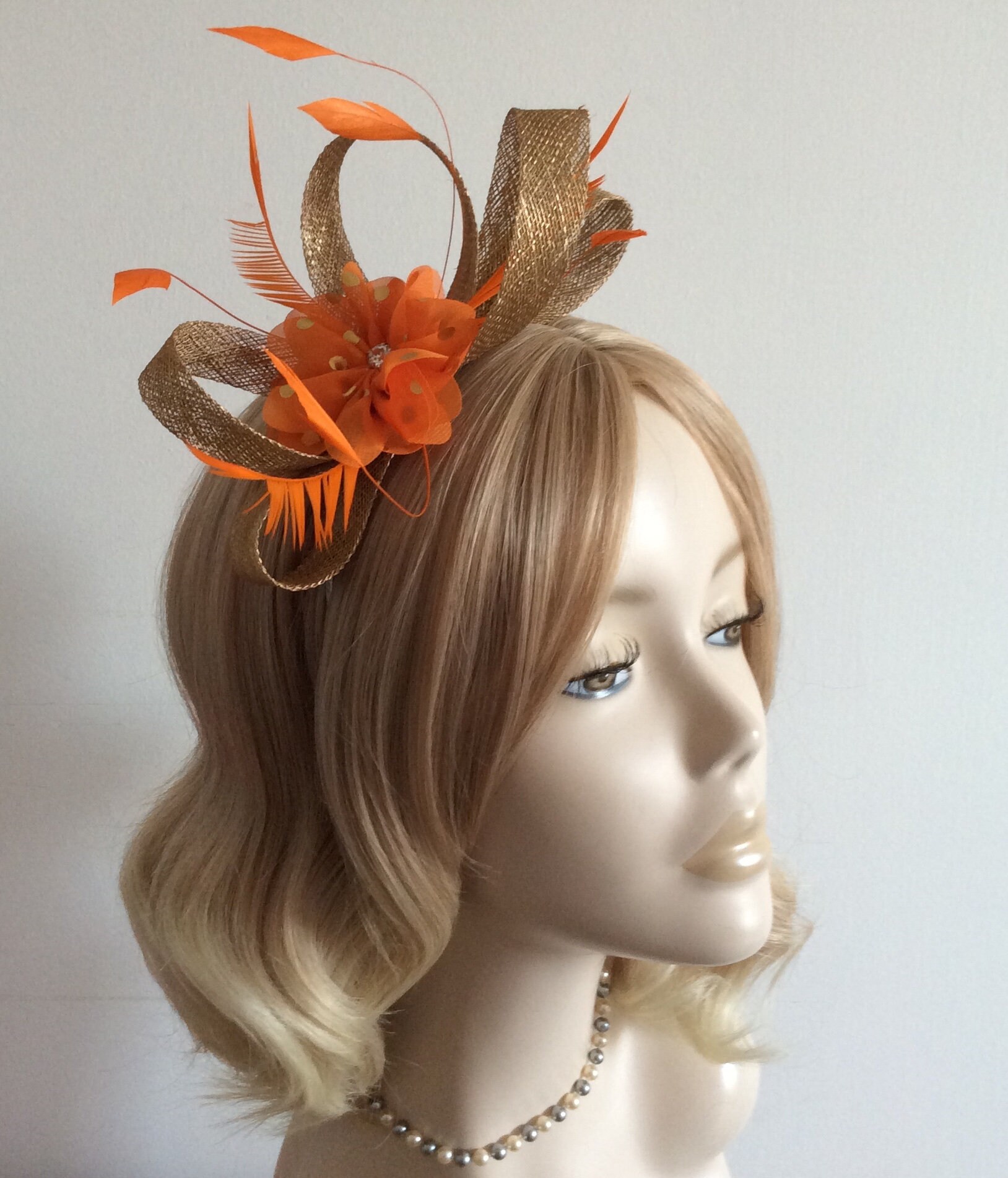 A METALLIC GOLD and ORANGE Fascinator 