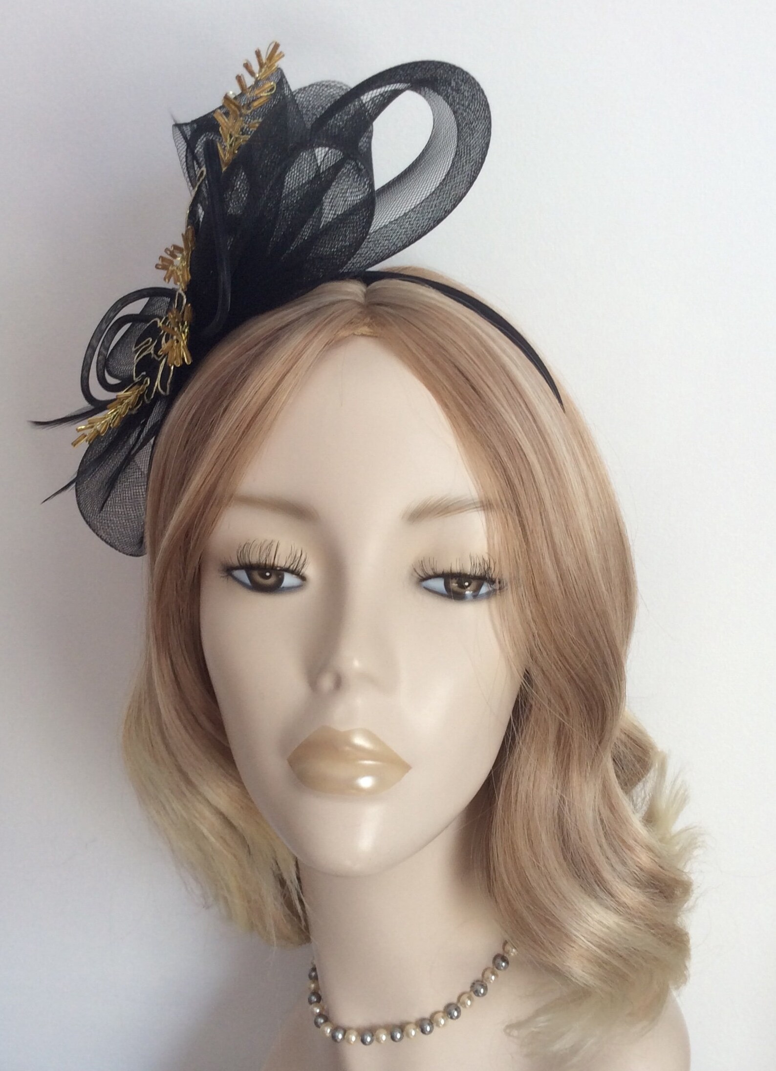 A BLACK and GOLD FASCINATOR Fabric flower beaded leaves Etsy