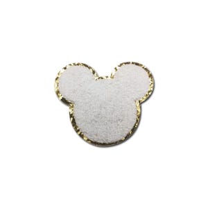 May include: White fuzzy mouse head shape with a gold glitter outline.