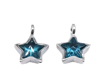 May include: Two silver star-shaped charms with blue crystal centers.