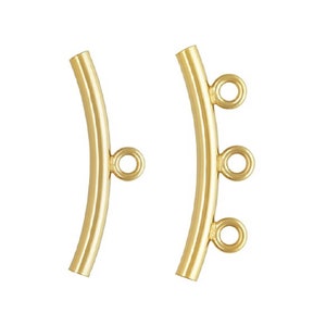 May include: Two gold-toned metal jewelry connectors with curved bars and multiple jump rings. The connectors are designed to be used for attaching jewelry pieces together.