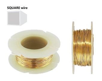 May include: A spool of gold-colored square wire on a white plastic spool.  SQUARE wire is printed on the image.