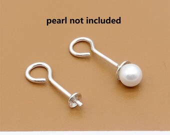 May include: Two silver earring findings with a loop at the top and a small post at the bottom. The text "pearl not included" is written above the findings.