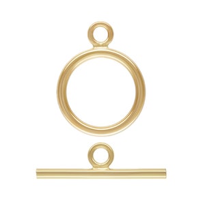 May include: Gold-toned metal toggle clasp with a round ring and a straight bar. The clasp is used for necklaces, bracelets, and other jewelry.