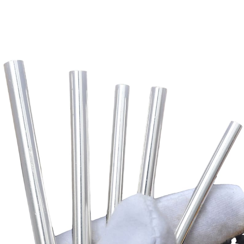 May include: Five silver metal tubes of varying lengths.
