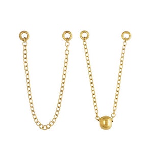 May include: Two gold chains with jump rings at the top and a single gold bead at the bottom of one chain.