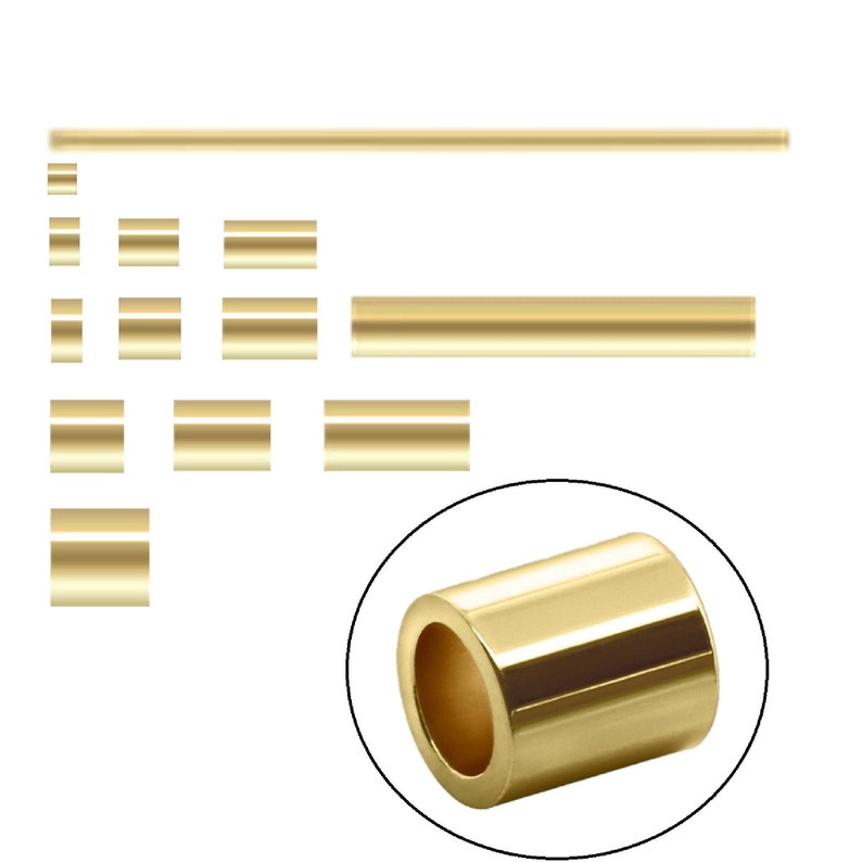 May include: Gold-colored metal spacer beads in various sizes. The beads are round and have a smooth, polished finish. The largest bead is approximately 1 inch in diameter.
