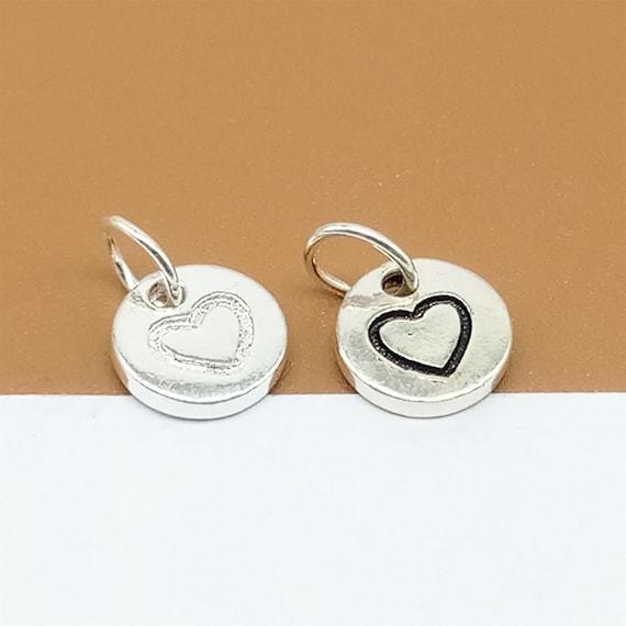 Sterling silver heart disc earrings. Sterling silver heart disc earrings.